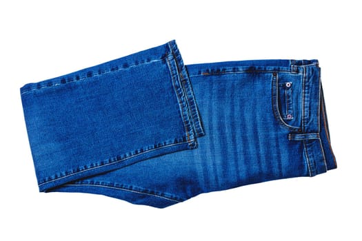 Jeans isolated. Folded trendy stylish blue denim stretch pants or trousers for men isolated on a white background. Clipping path. Jeans summer and autumn fashion.