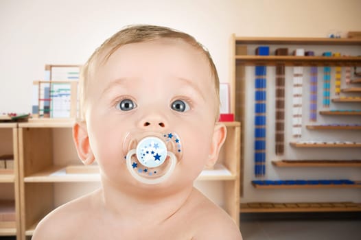 Cute toddler baby at Montessori school