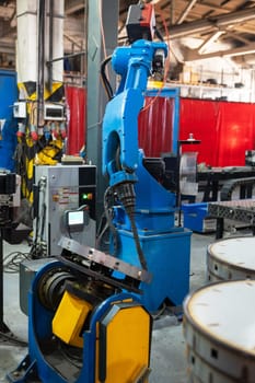 Automatic Industrial welding robot in a modern factory in operation.