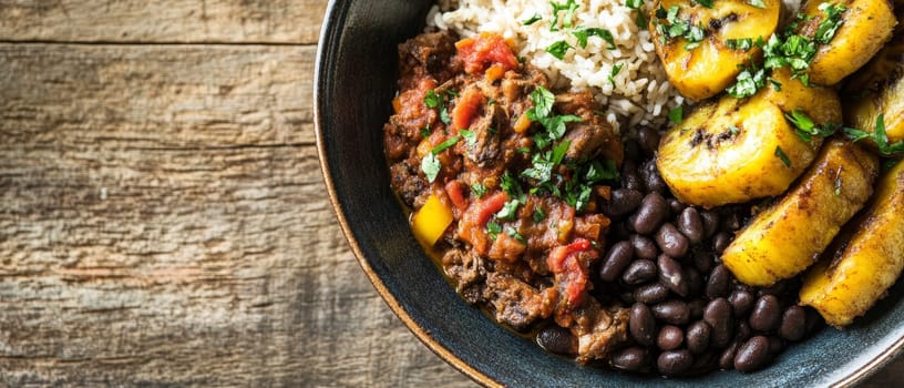 A rustic Cuban inspired rice bowl featuring tender beef, black beans, fried plantains, and fresh herbs, served on a wooden background with vibrant colors and textures.
