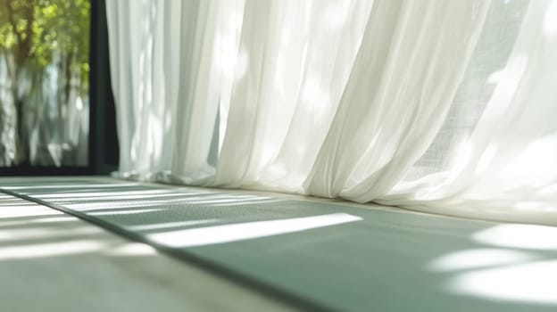 Soft sunlight filters through white curtains onto a yoga mat in a quiet room, creating a calming, relaxing atmosphere.