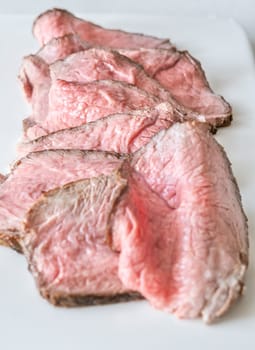 Portion of sliced roast beef on the plate
