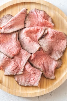 Portion of sliced roast beef on the plate