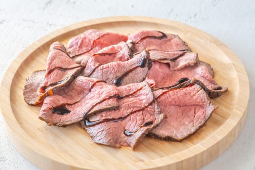 Portion of sliced roast beef on the plate
