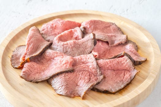 Portion of sliced roast beef on the plate