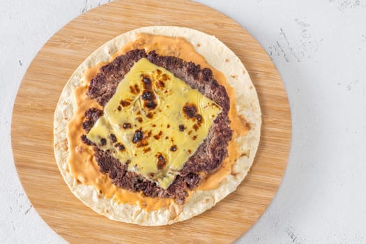 Portion of taco with beef mince and cheese