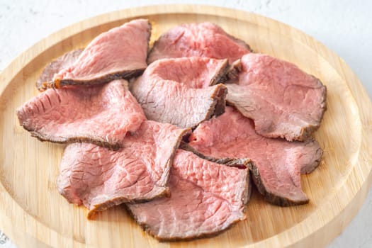 Portion of sliced roast beef on the plate