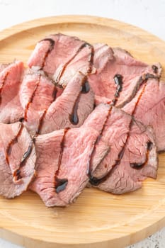 Portion of sliced roast beef on the plate