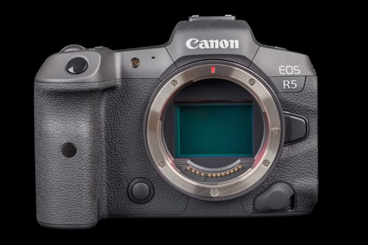 Canon R5 - black professional 35mm full-frame mirrorless camera body with flip screen isolated on black background with focus stacking - Tula, Russia, September 15, 2021