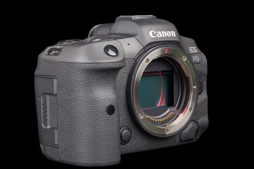 Canon R5 - black professional 35mm full-frame mirrorless camera body with flip screen isolated on black background with focus stacking - Tula, Russia, September 15, 2021