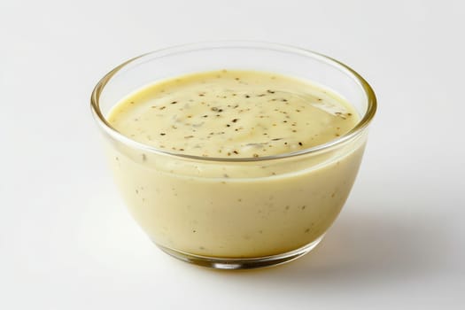 This creamy Caesar dressing showcases a rich blend of flavors in a clear glass bowl, perfect for enhancing salads or serving as a dip for appetizers at any meal.