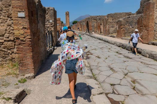 Pompeii, Italy - August 8, 2024: Ruins of a city. Pompeii is an ancient Roman city died from the eruption of Mount Vesuvius in 79 AD.