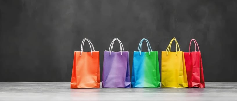 A row of vibrant shopping bags on a dark surface, ideal for retail and fashion promotions.