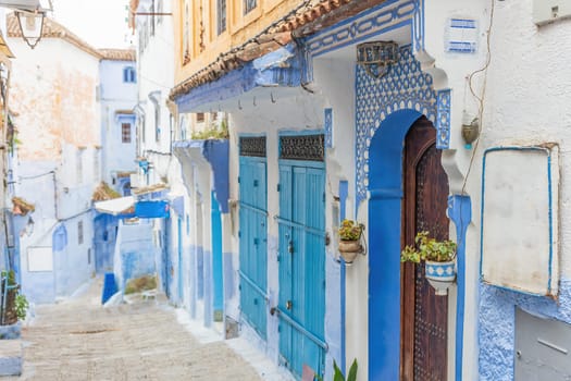 Old alley in the historic blue town Chefchaouen in Morocco. Horizontally.