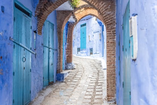 Archway in a empty  street in the blue city of Chefchaouen.  Morocco.  Horizontally. Morocco.