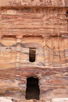 Closeup view of the entrance to one of the temples in Petra archaeological site.  Jordan. Vertically.