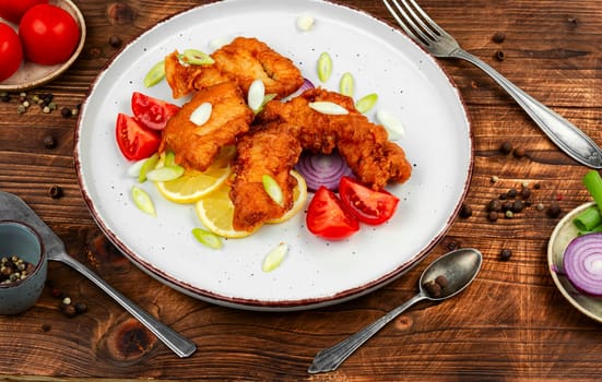 Fried cod fish on a plate. crispy Golden fish fillet fried in batter