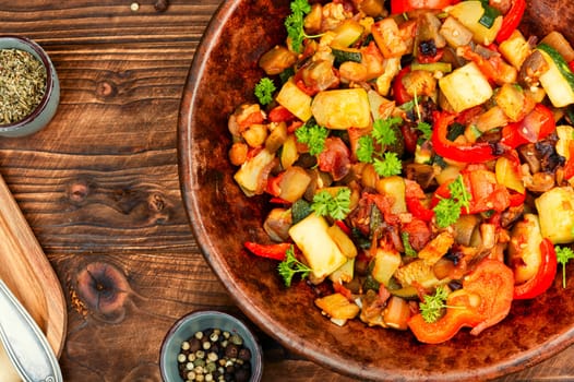French vegetable dish, ratatouille. Baked eggplants, zucchini, peppers and tomatoes.