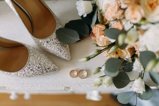 Wedding shoes and wedding paraphernalia, wedding bouquet, wedding gold rings