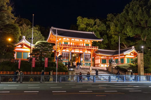 Tourists enjoying the illuminated heian shrine at night in kyoto, japan