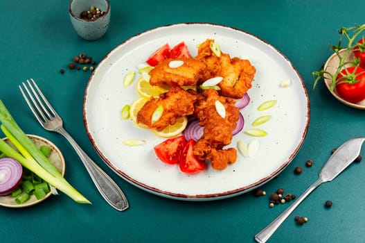 Juicy pieces of fried cod fish. Fried fish with a crispy crust.