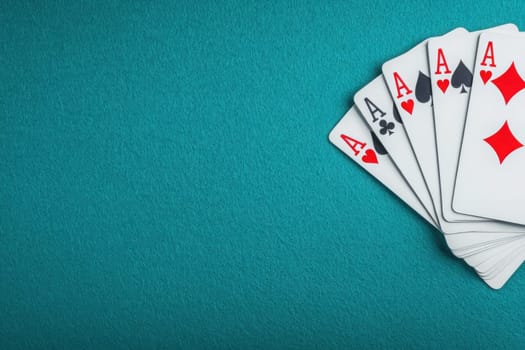 A pyramid of playing cards is artfully stacked on a clean, solid surface, showcasing a blend of suits and numbers, demonstrating skill and balance during a card game or artistic display.
