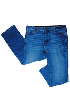 Jeans isolated. Folded trendy stylish blue denim stretch pants or trousers for men isolated on a white background. Clipping path. Jeans summer and autumn fashion.
