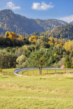 Picturesque view of the autumn landscape in the Pieniny Mountains, colorful leaves on the trees, gravity slide, Szczawnica, Poland.