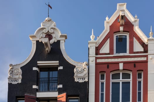 Typical Amsterdam houses over the blue sky