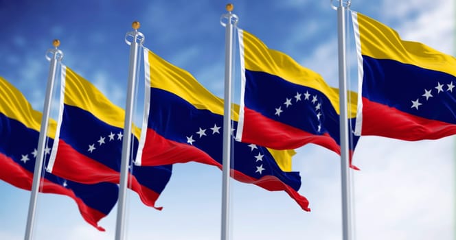 Venezuela national flags waving on a clear day. Tricolor of yellow, blue and red with an arc of eight white five-pointed stars in the center. Seamless 3d render animation. Slow motion loop
