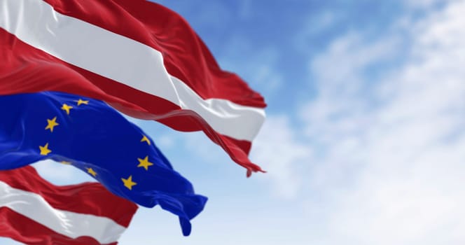 Flags of Latvia and the European Union waving on a clear day. Latvia is a member of the European Union and the Eurozone. 3d illustration render. Fluttering fabric