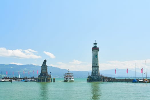 Harbor entrance of Lindau on Lake Constance, Bodensee with an arriving passenger ship