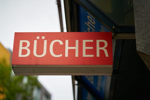 red sign with the German inscription Bucher to indicate a bookshop. Translation: Books