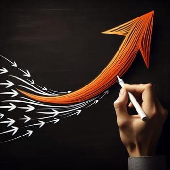A hand drawing a large orange arrow on a blackboard. The arrow is pointing upwards, while smaller white arrows are pointing downwards, representing overcoming challenges. A high-quality photo.