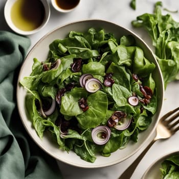 A bowl of fresh spinach salad with red onion and dried cranberries, representing healthy and delicious food. A high-quality AI-generated photo.