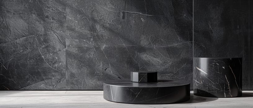 This display contrasts the deep, textured surface of dark stone platforms against a rugged backdrop, with subtle lighting emphasizing the materiality
