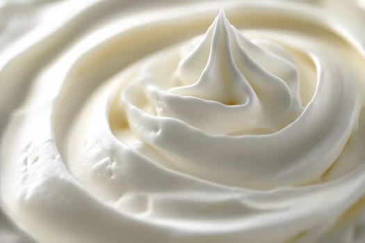 A beautifully crafted swirl of clean whipped cream highlights its soft peaks and smooth texture, perfect for desserts or coffee embellishments, evoking a sense of simplicity and elegance.