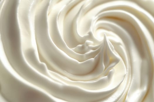 A clean swirl of whipped cream displays its smooth texture and glossy finish, emphasizing simplicity and elegance in presentation.
