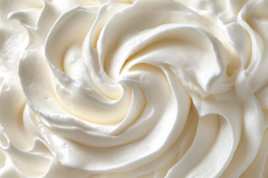 A beautifully crafted swirl of clean whipped cream sits ready for use in dessert preparations, showcasing its texture and simplicity in a minimalist setting, embodying culinary artistry.