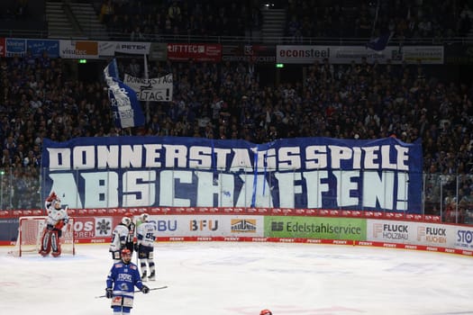 Abolishing Thursday games,is written on a banner of the Schwenninger fans,plus confetti rain on the ice brings a game interruption in the game of the DEL 24-25,10th Sptg.: Schwenninger Wild Wings vs Iserlohn Roosters