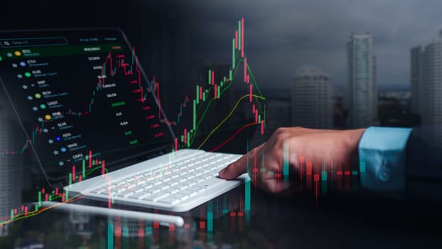 Investors use laptops to analyze stock market, investment strategies. and business growth analysis, investing in companies with long-term competitive advantages, Broker use tablet analysing trading.