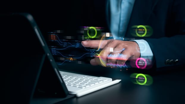 Businessman using tablet for development and Analytics Data technology management System for report marketing strategy planning, Graph analysis and information on a futuristic virtual screen.
