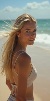 A blonde woman in a swimsuit gazes back while standing near the shoreline. Gentle sea waves lap at her feet under a clear blue sky. Long hair, beautiful young face. Travel and clothing adverts. AI.