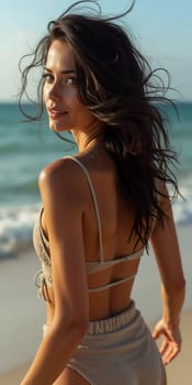 A brunette woman in a swimsuit gazes back while standing near the shoreline. Gentle sea waves lap at her feet under a clear blue sky. Long hair, beautiful young face. Travel and clothing adverts. AI.
