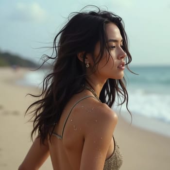 A brunette woman in a swimsuit gazes back while standing near the shoreline. Gentle sea waves lap at her feet under a clear blue sky. Long hair, beautiful young face. Travel and clothing adverts. AI.