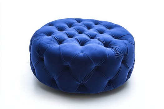 A stylish blue ottoman featuring tufted upholstery sits alone in a minimalist space, inviting comfort and adding a pop of color to the decor. Ideal for lounging or as a decorative piece.