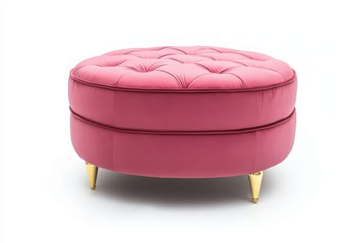This charming pink ottoman features tufted upholstery and golden legs, adding a touch of elegance. It serves as a versatile piece for seating or decor in modern, cozy interiors.