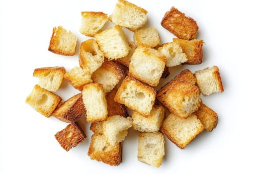 These croutons, perfectly toasted to a golden brown, are scattered in an artistic arrangement on a bright white surface, showcasing their crunchy texture and appealing color.