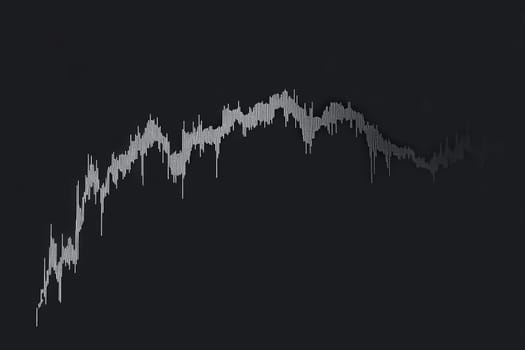A detailed representation of a stock market graph shows a consistent downward trend. The clean and minimalist design emphasizes the significant decline in market values over time.