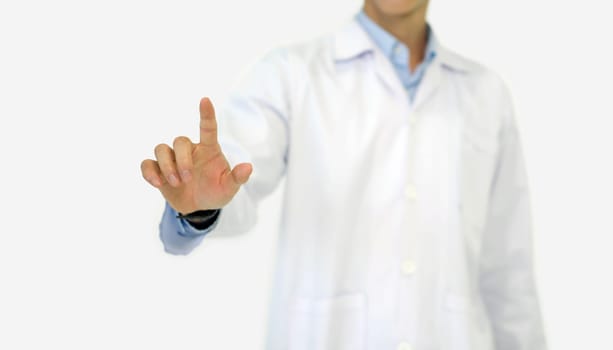 A doctor in a white lab coat pointing finger toward with his hand. Portrait on white background, studio shot.
